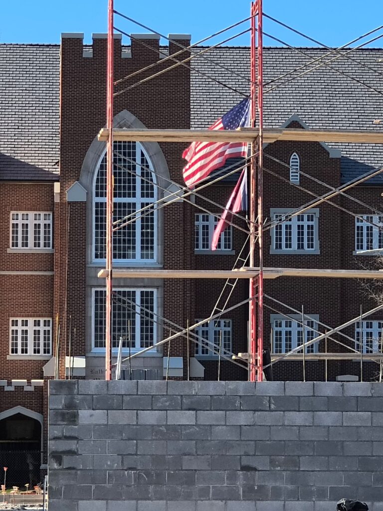 school build with American flag