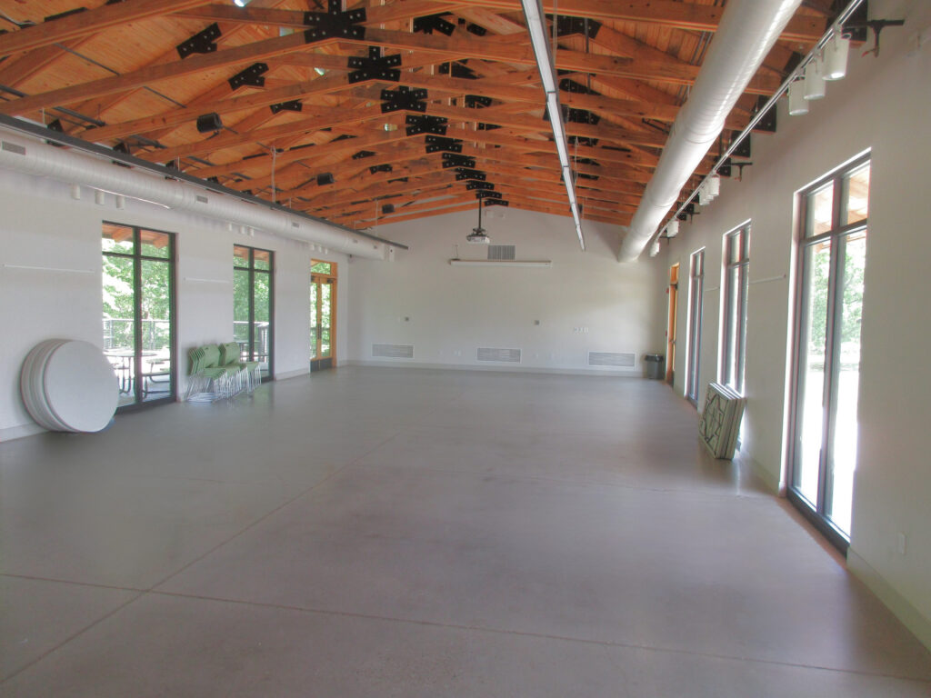 open room with floor to ceiling windows